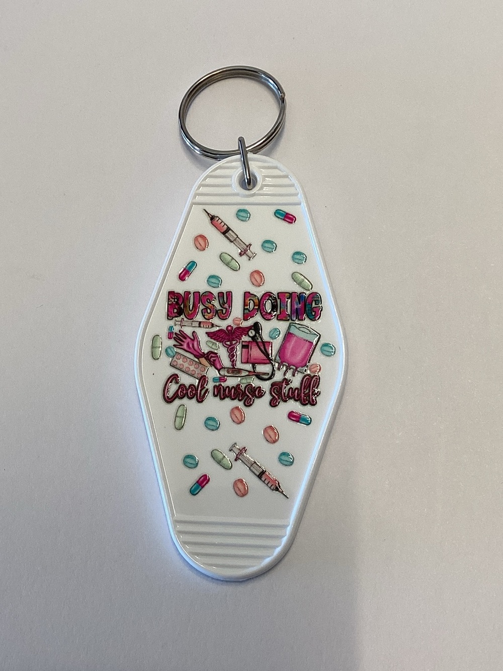 White Nurse-Themed Keychain Charm with Pink & Teal Accents
